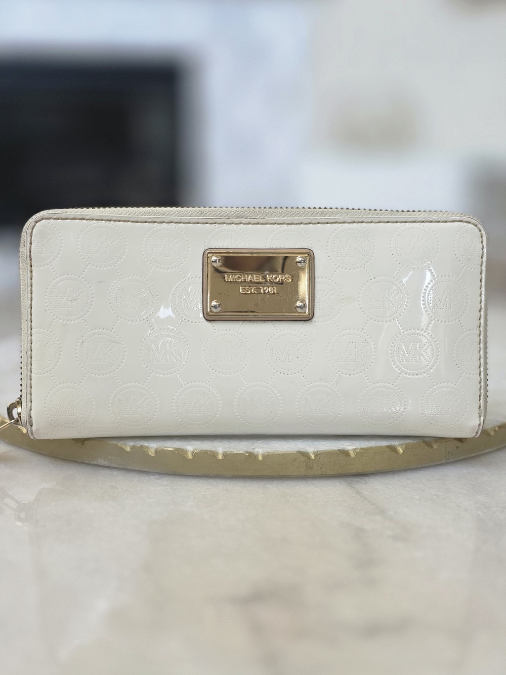 Michael Kors Fulton Continental Zip Around Wallet in Cream Embossed Leather.